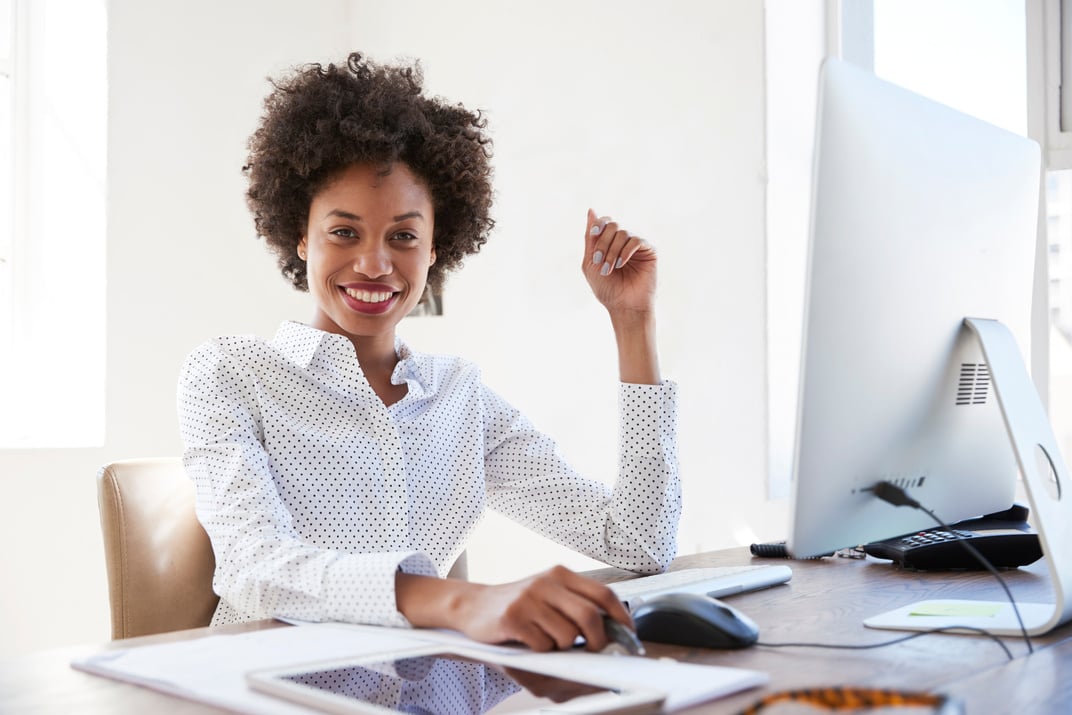 Woman at Her Work Desk with a Computer 